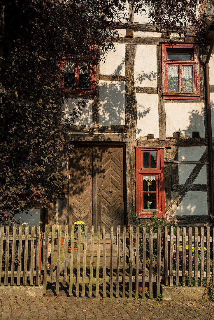 Old half-timbered house with red windows, Ziegenhain, Hesse, Germany, Europe