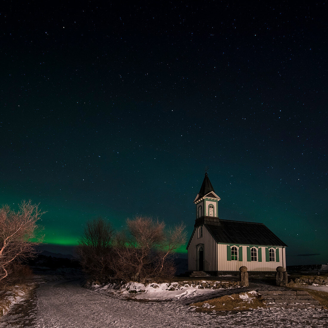 Aurora borealis (Northern Lights) and pingvallakirkja Church at Thingvellir National Park (pingvellir National Park) in winter at night, Pingvellir National Park, Sudurland, Iceland, Europe