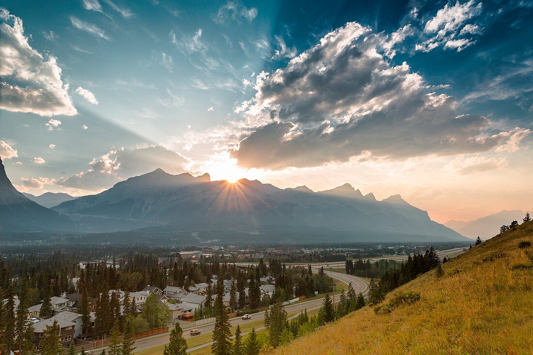 Foothills, mountains and clouds at sunset