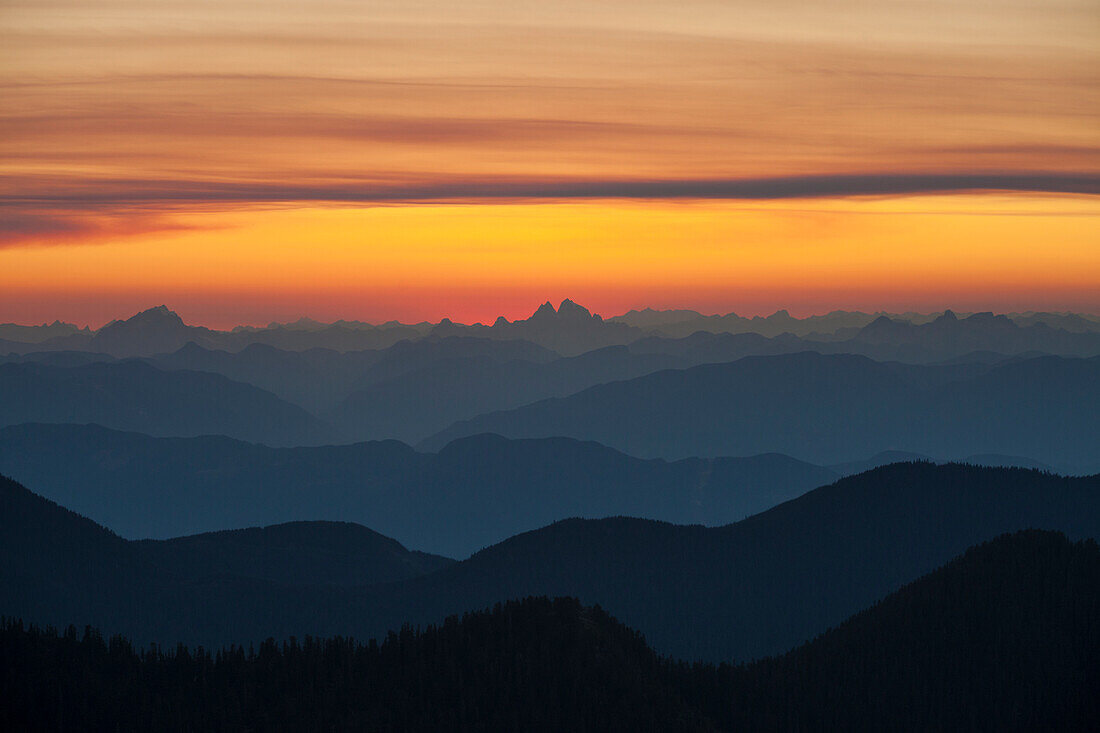 Layers of mountains in the North Cascades and Coastal Mountain ranges as seen from Chilliwack, British Columbia, Canada.