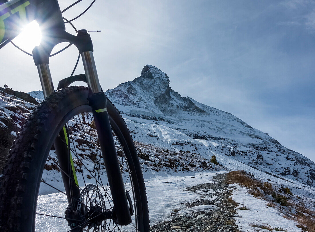 'Mountain biking in the Pennine Alps with a view of the Matterhorn, near Zermatt; Valais, Switzerland'