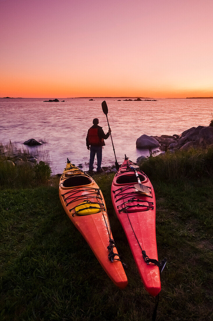 'Kayaks along Atlantic Ocean coastline, Bear Point; Nova Scotia, Canada'