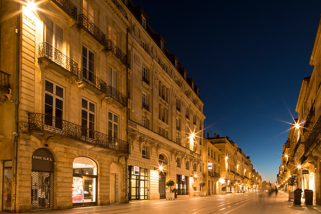 Historic shopping street Cours de l'Intendance at dusk