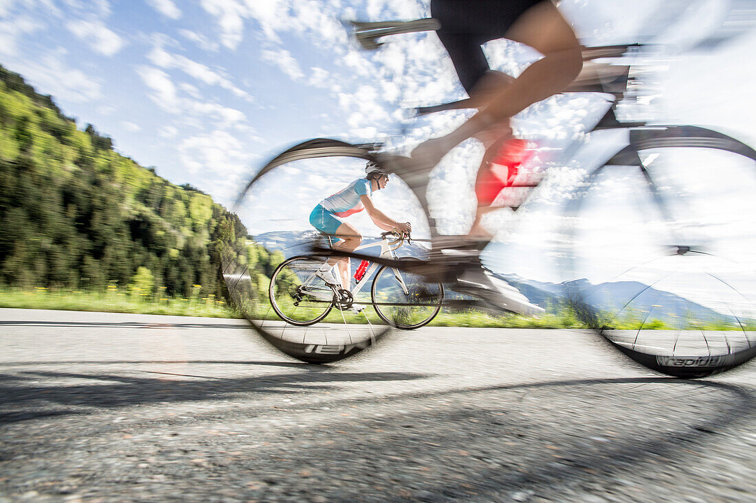 Two young people on their racing cycles in the Kitzbühler Alps, Kitzbühlerhorn, Tyrol, Austria