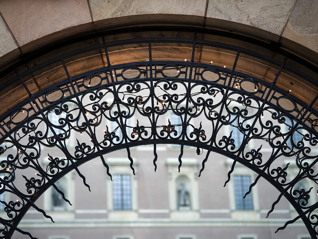 Close-up of the ornate design on an archway with a building in the background, Stockholm, Sweden