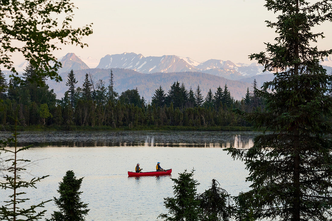A couple canoeing on Stone Step Lake, Homer, Alaska, United States of America