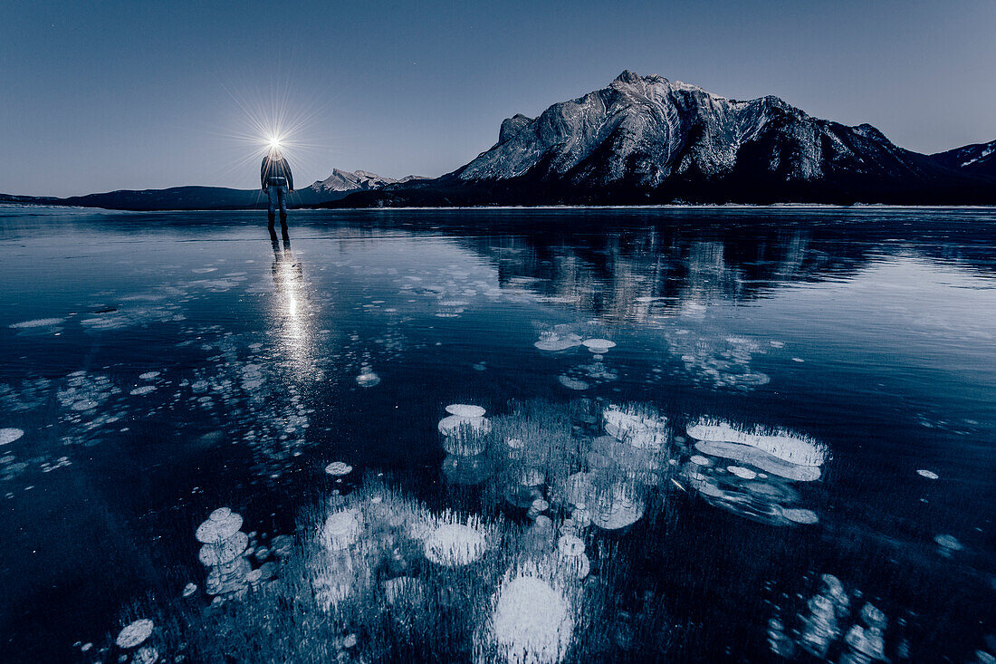 man standing on Abraham Lake, Jasper National Park, Alberta, Kanada, north america