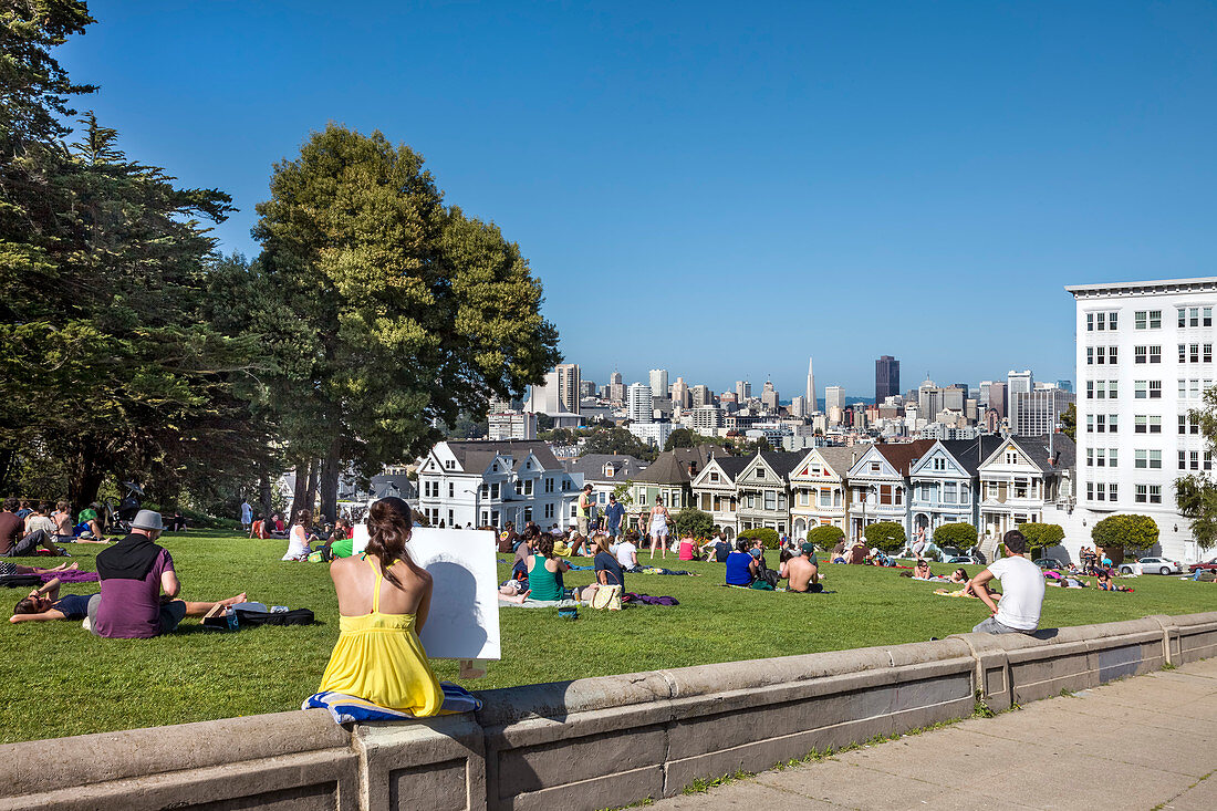 People relaxing in the park, Alamo Square, San Francisco, California, USA