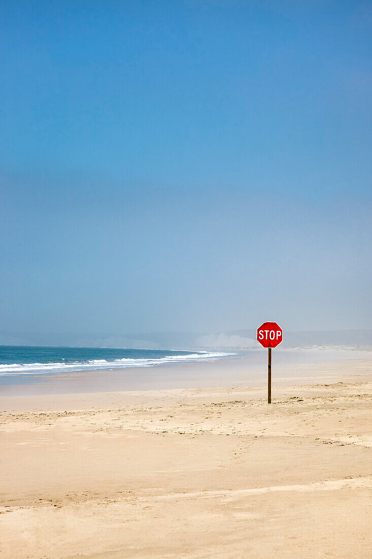 Stop sign on the beach, Point Reyes National Seashore, Marin County, California, USA