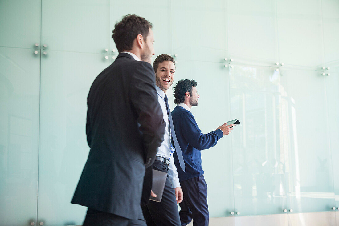 Business associates chatting while walking together