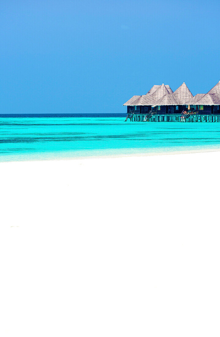 Tropical beach and over-water villas, Coco Palm, Dhuni Kolhu, Baa Atoll, Republic of Maldives, Indian Ocean, Asia