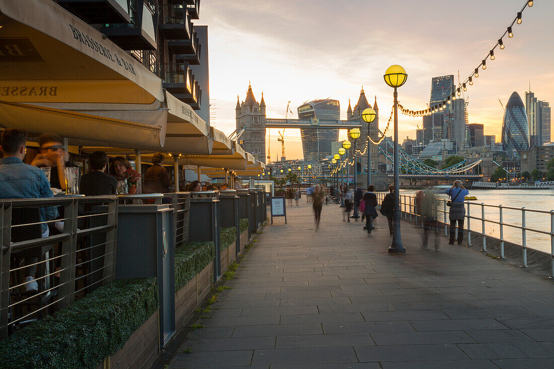 Tower Bridge and City of London skyline from Butler's Wharf at sunset, London, England, United Kingdom, Europe