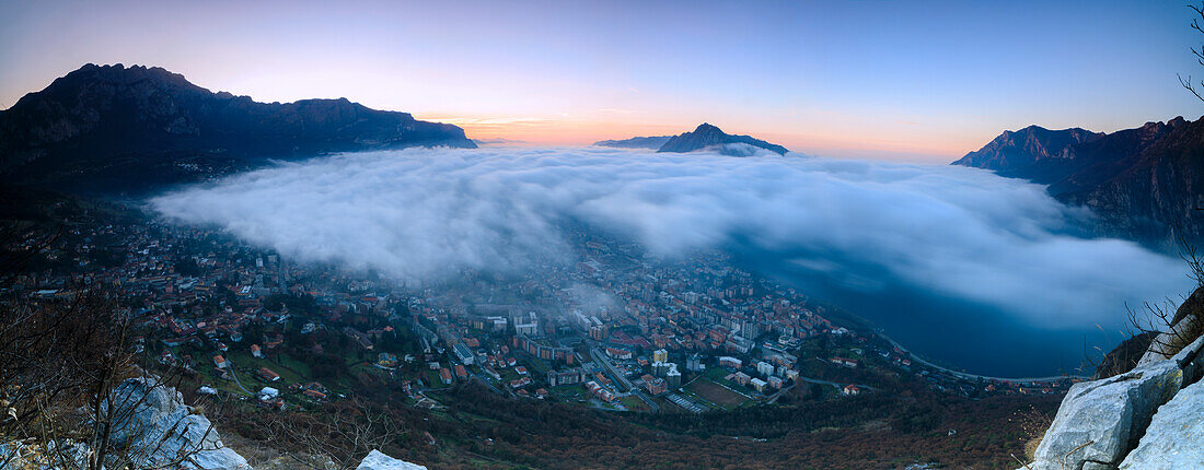 Panoramic of fog at sunrise above the city of Lecco seen from Monte San Martino, Province of Lecco, Lombardy, Italy, Europe