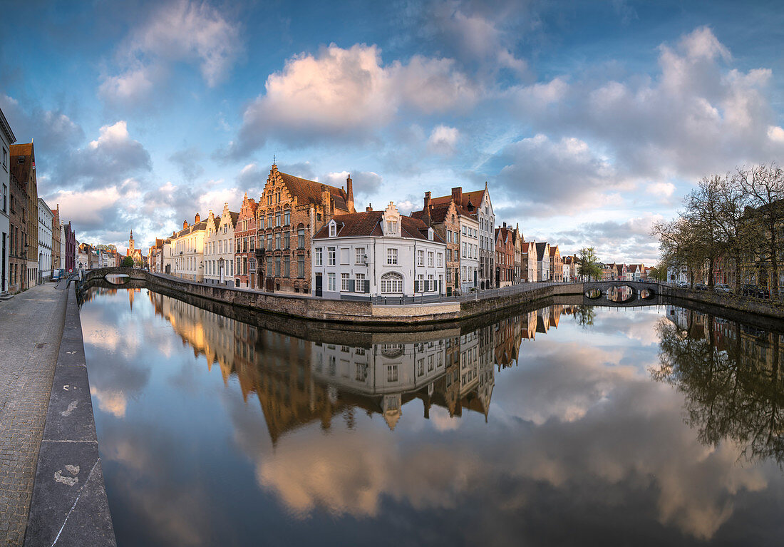Pink clouds at dawn on the Belfry and historic buildings reflected in the typical canal, Bruges, West Flanders, Belgium, Europe