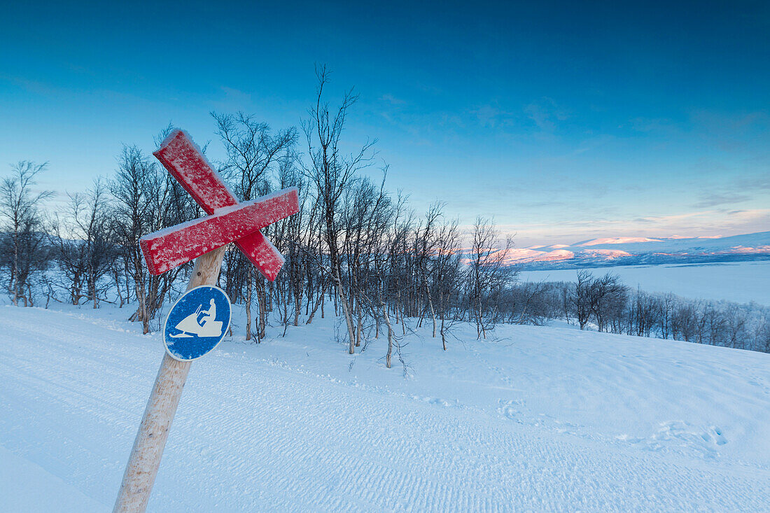 Signboard on the snowy ski slopes, Bjorkliden, Abisko, Kiruna Municipality, Norrbotten County, Lapland, Sweden