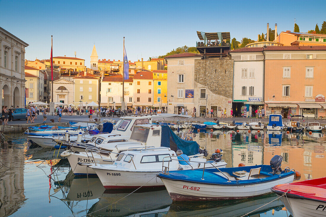 Piran, Slovenian Istria, Slovenia, The harbour at sunset with some colorful fishermen boats