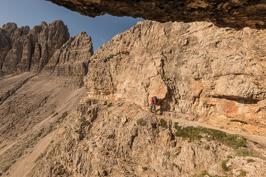 Sesto/Sexten, Dolomites, South Tyrol, province of Bolzano, Italy, An hiker walk on a First World War path near Forcella Passaporto