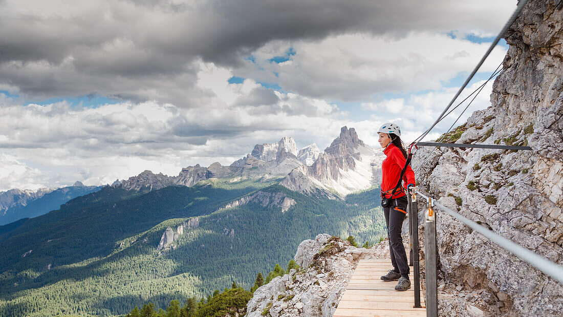 a climber looking the Panorama during a via ferrata, Belluno province, Veneto, Italy