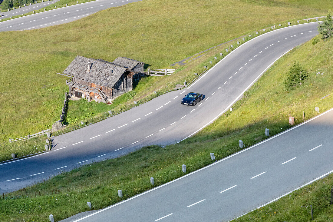 A Porsche car on grossglockner alpine road bends, Hohe Tauern National Park, Carinthia, Austria