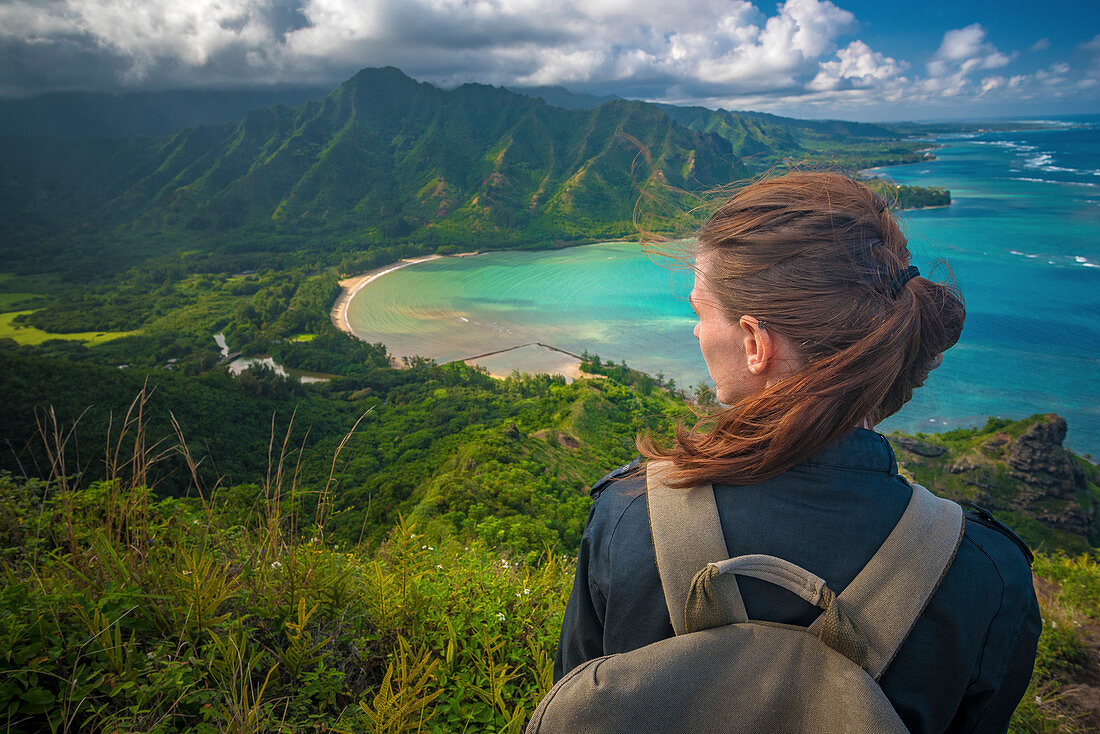 hiker takes in the view from crouching lion hike on the north shore of oahu