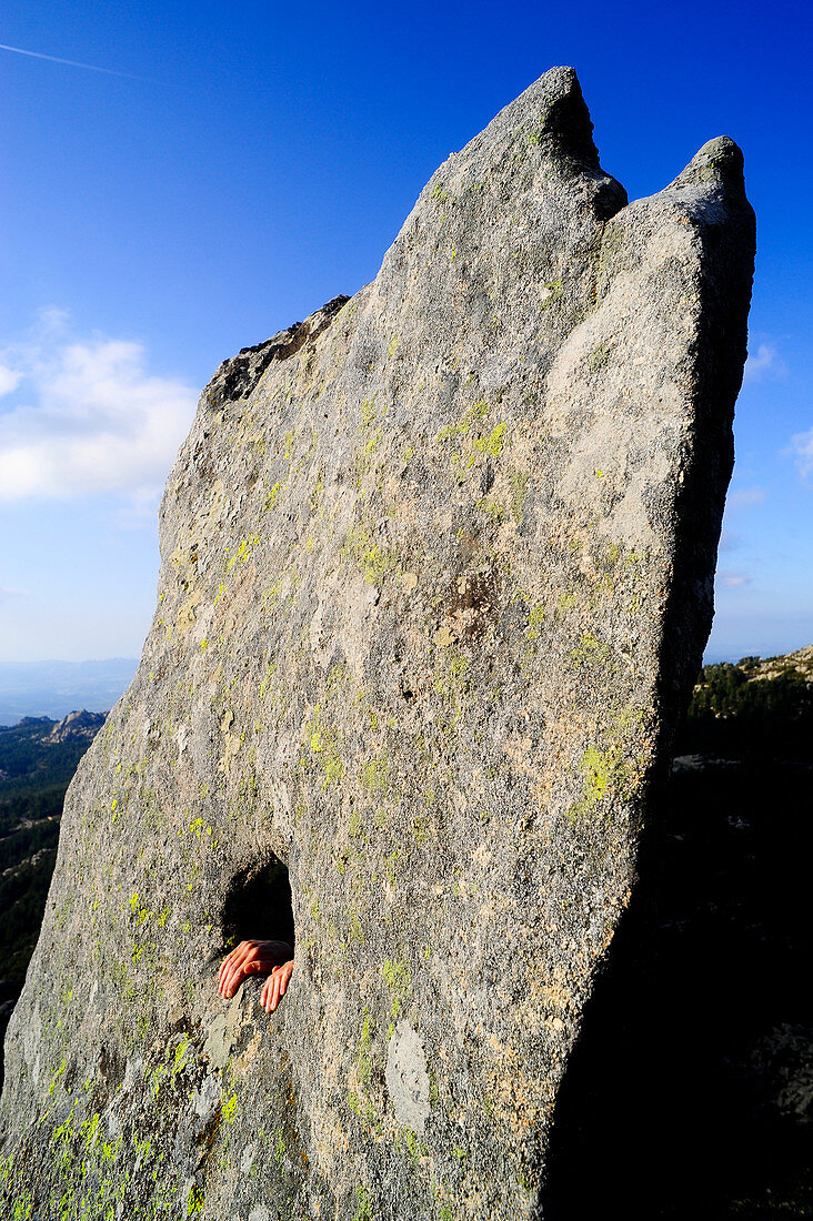 Climber hands in a hole. Valliciola, Sardinia, Italy