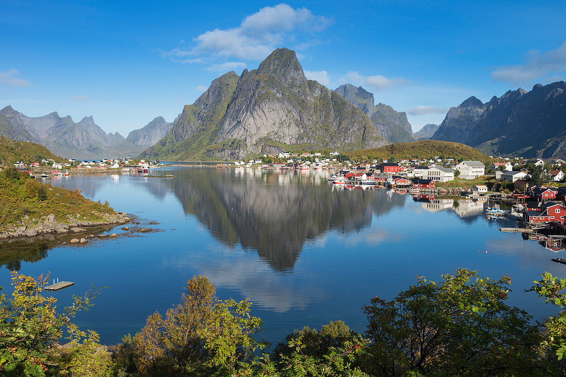 Reflection of Olstind mountain peak in Reine harbor, MoskenesÃ¸y, Lofoten Islands, Norway