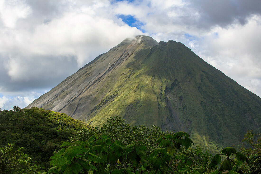 Arenal Volcano, an active volcano sits in the province of Alajuela, Canton of San Carlos, and district of La Fortuna, Costa Rica.