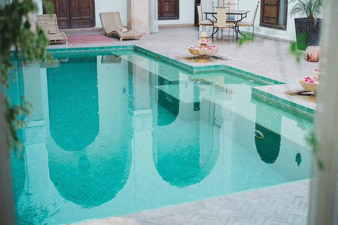 Photograph of empty swimming pool in Moroccan riad, Marrakech, Morocco