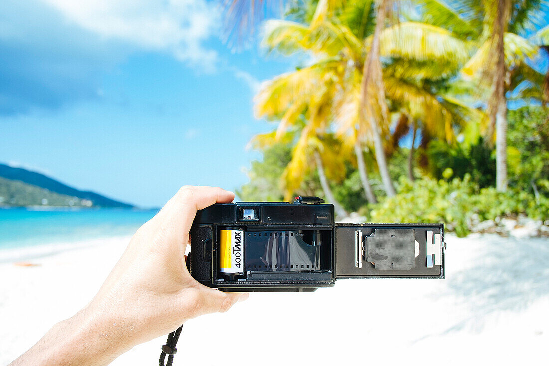 Close-up Of Person Hand Holding Shoot Film Camera With Loaded Point