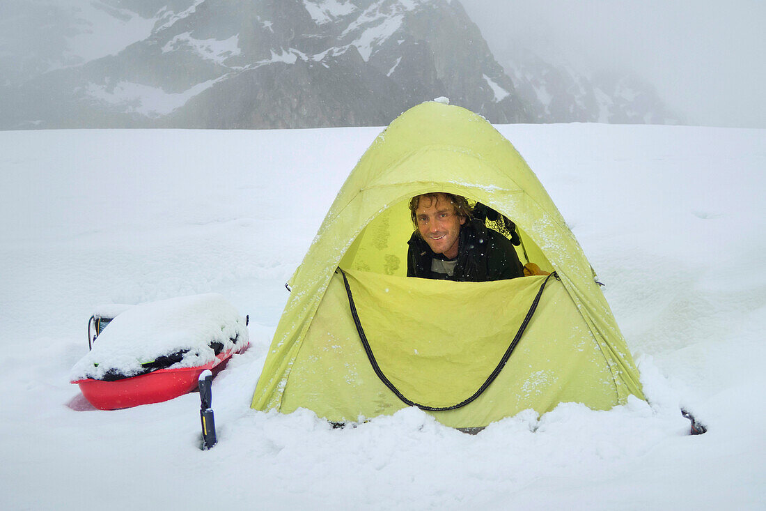 A portrait of mountaineer and climbing ranger Shane Treat in a tent on the slopes of Denali in Alaska.