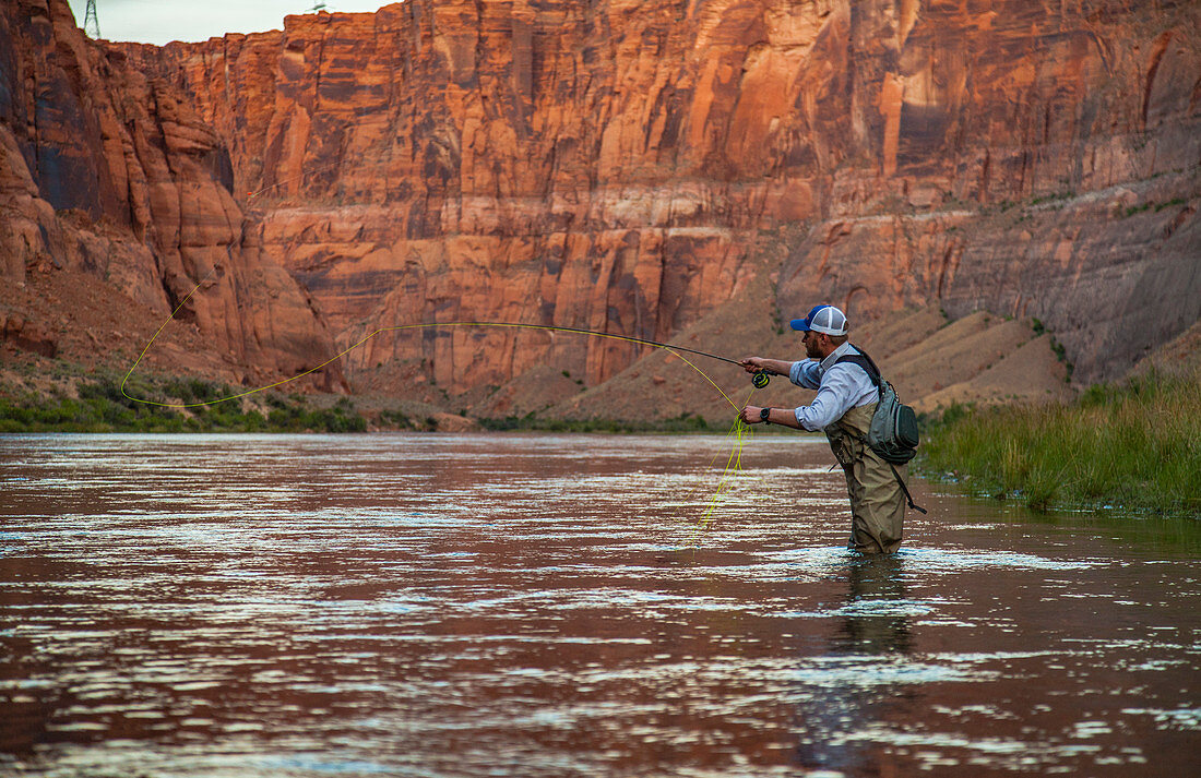 Man Fly Fishing On The Colorado River In The Grand Canyon