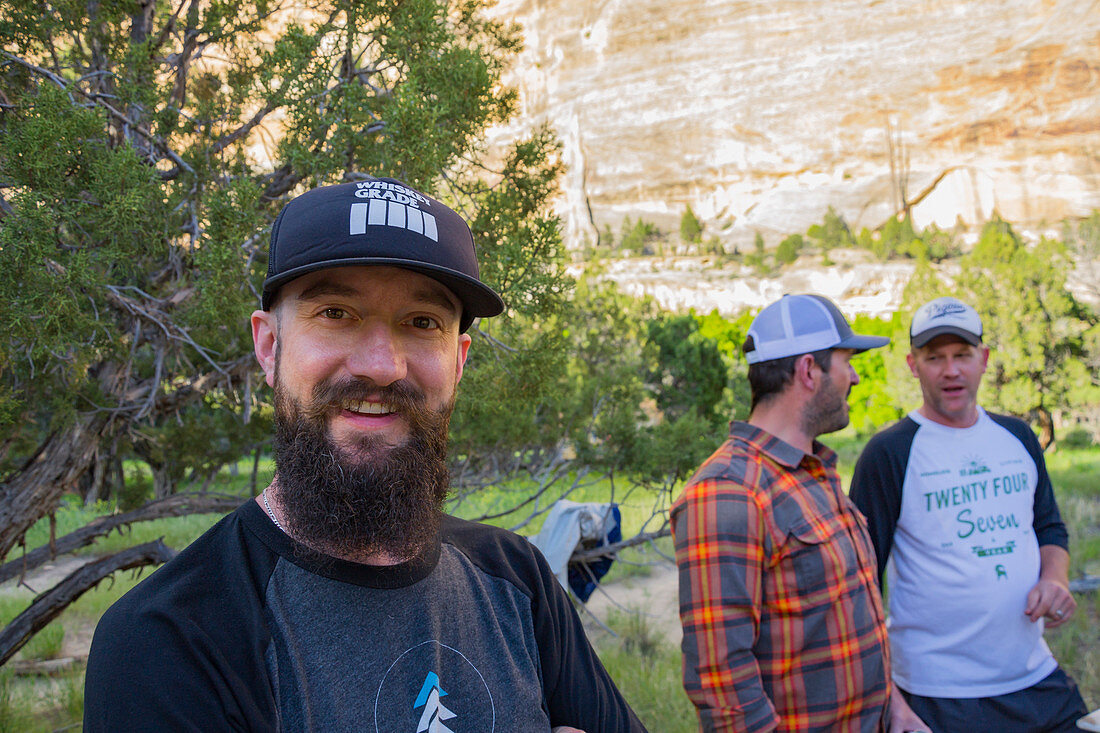 Group Of Men Standing In Dinosaur National Monument In Colorado