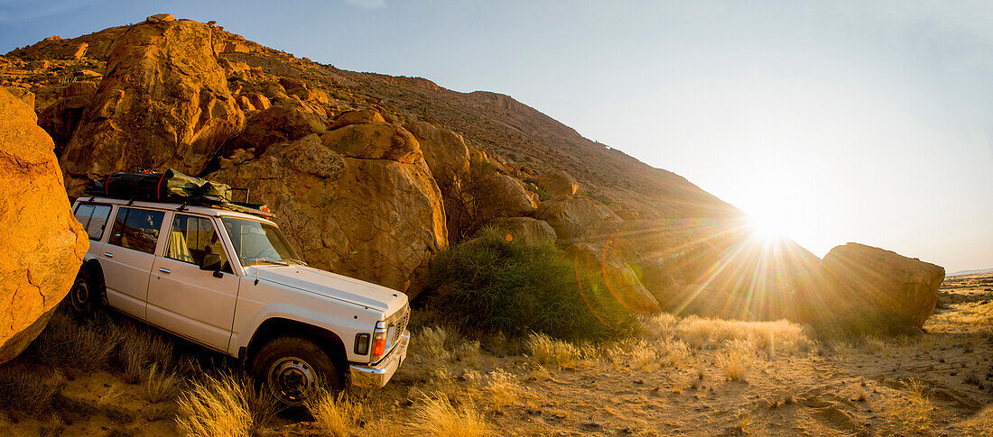 Photograph of 4x4 car in desert during bouldering expedition, Spitzkoppe, Erongo region, Namibia