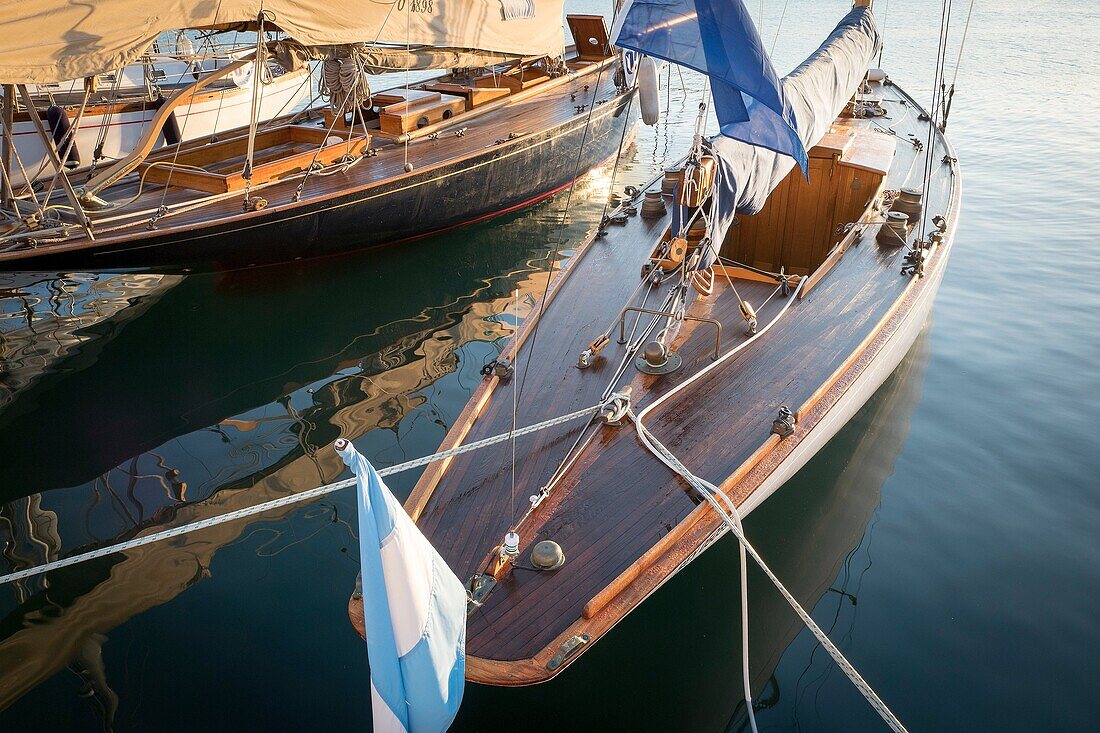 Moored vintage sailboats in the early morning. Port of Mahó, Minorca, Balearic Islands, Spain