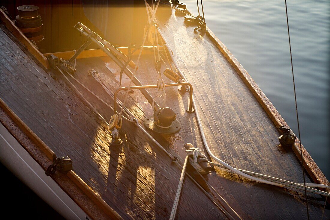 Moored vintage sailboat in the early morning, detail of stern. Port of Mahó, Minorca, Balearic Islands, Spain