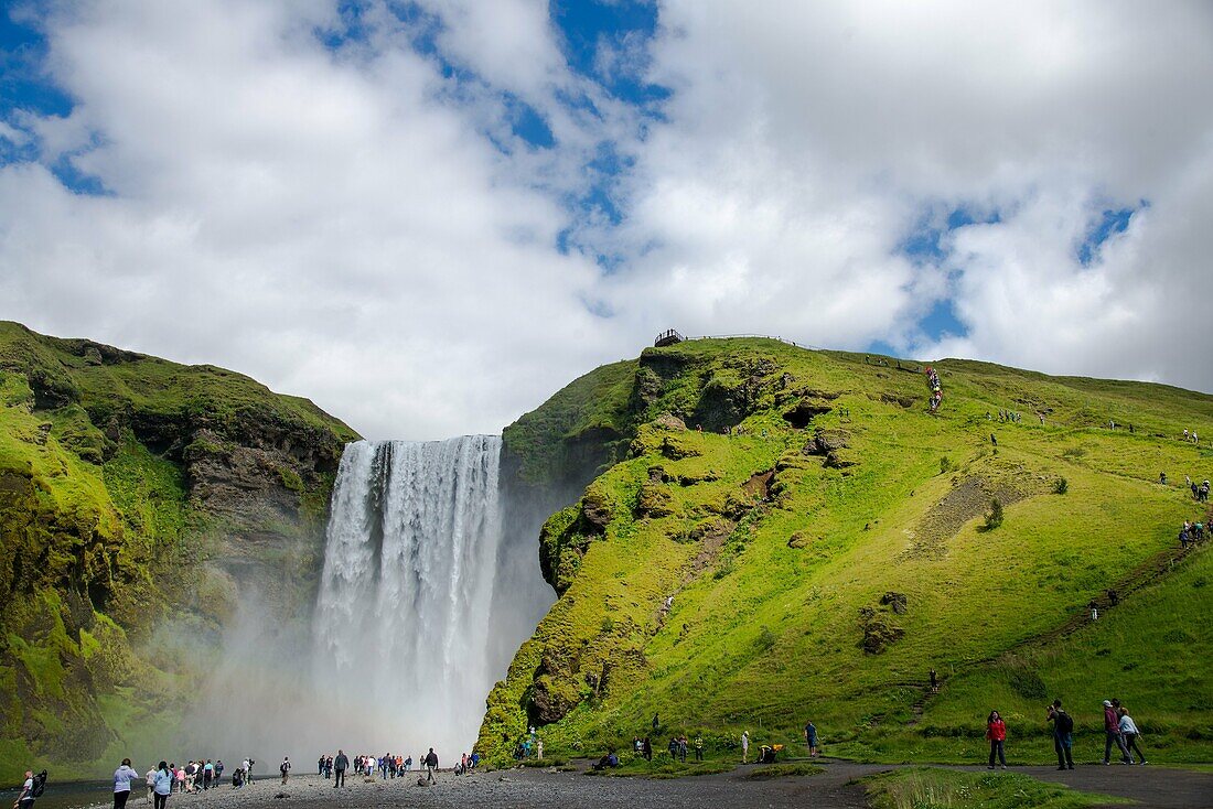 Skogafoss waterfall with rainbow at Iceland