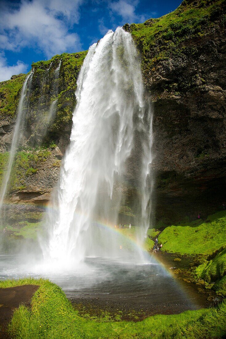 Seljalandfoss waterfall with rainbow at Iceland