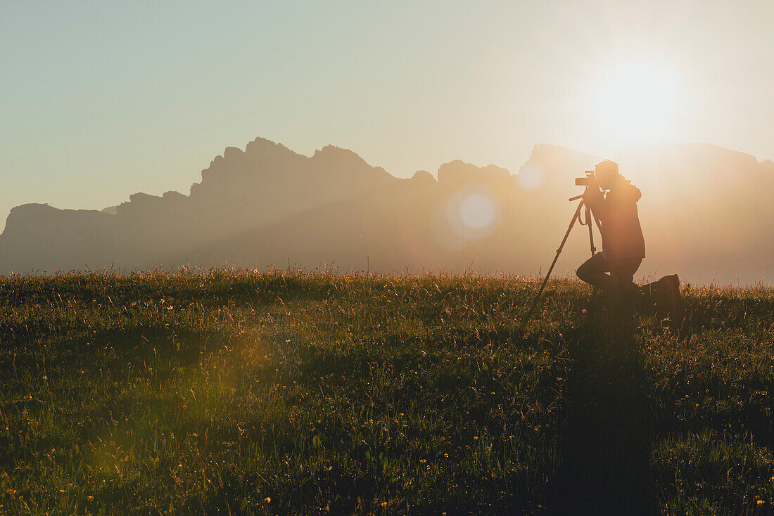 Alpe di Siusi/Seiser Alm, Dolomites, South Tyrol, Italy, A photographer catch the sunrise