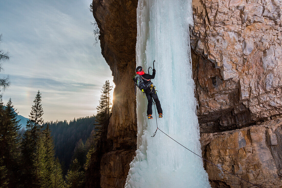 Dolomites, Fassa Valley, Italy, Europe, Trentino, Alps, Ice cascades, a man climbs with an ice-axe, block of frozen ice in the European Alps