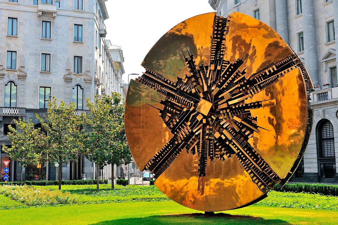 Giò Pomodoro bronze disc sculpture in Piazza Meda, downtown Milan, Italy