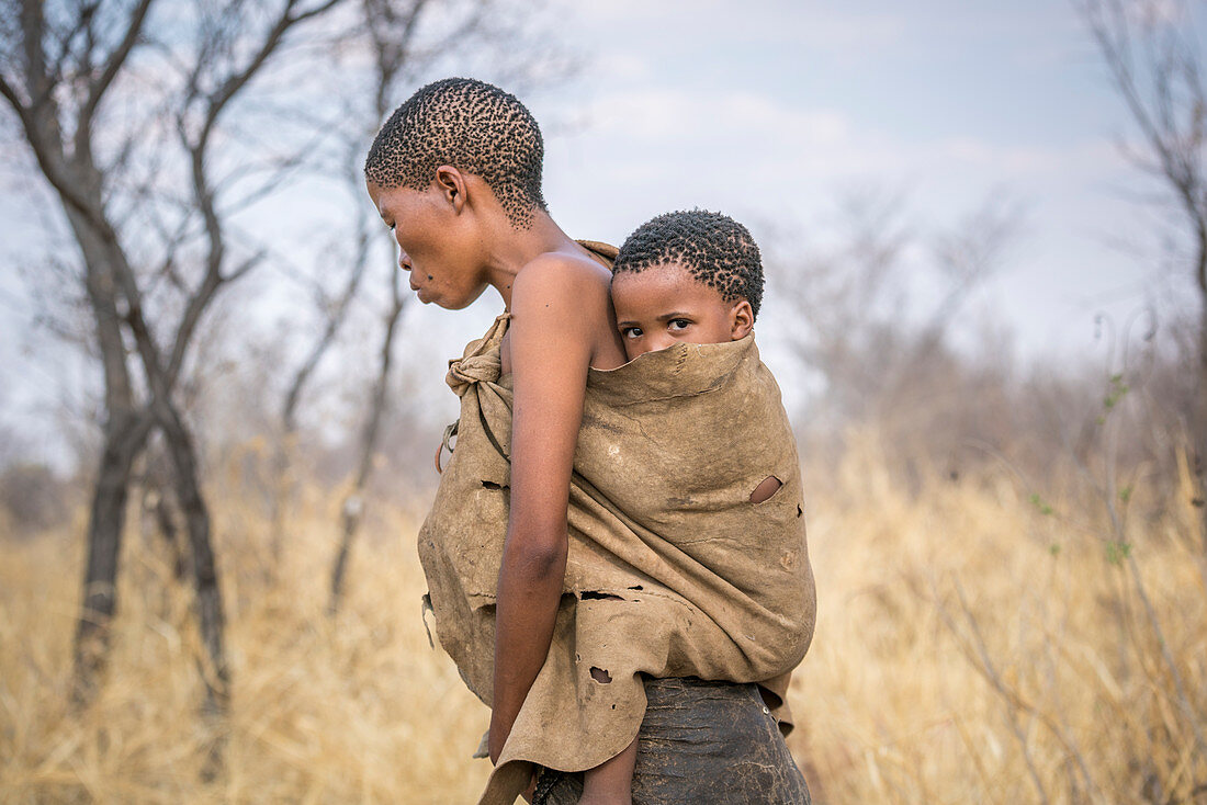 Mother and son in Bushman Hunters Living History Village, Grashoek, Otjozondjupa, Namibia, Africa