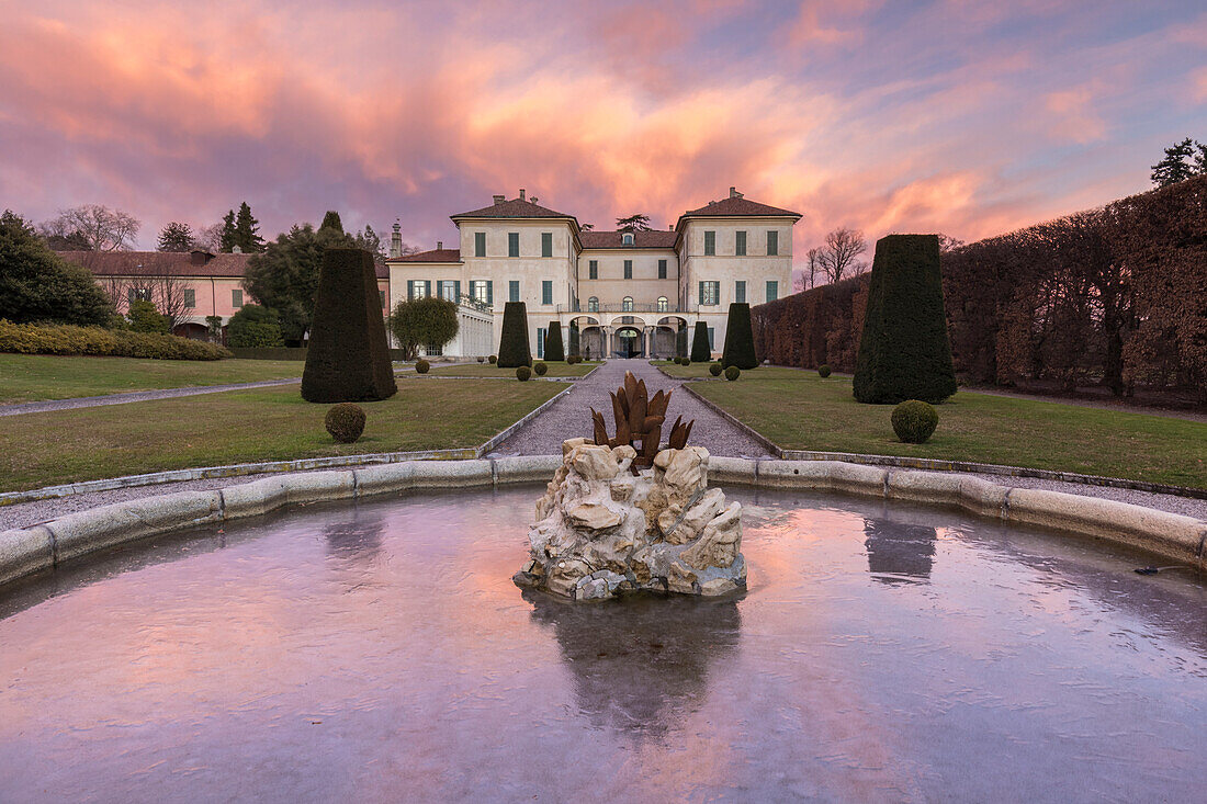 Reflections on the iced fountain of Villa Panza gardens, Varese, Lombardy, Italy