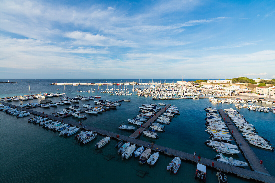Blue sea frames the boats moored in the harbor Otranto province of Lecce Apulia Italy Europe