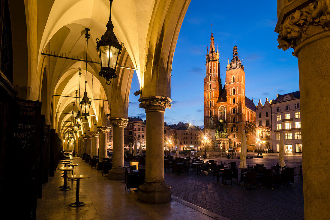 St. Mary's Church ,St. Marys Basilica, and main square illuminated at dawn, UNESCO World Heritage Site, Krakow, Poland, Europe