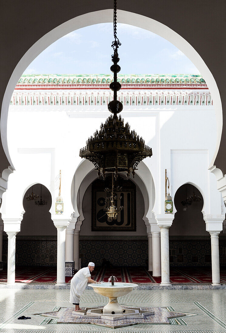 Local man washing in courtyard of Kairaouine Mosque ,Mosque of al-Qarawiyyin, UNESCO World Heritage Site, Fez, Morocco, North Africa, Africa