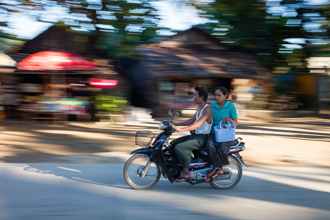 Couple on moped, Ngapali, Thandwe, Myanmar