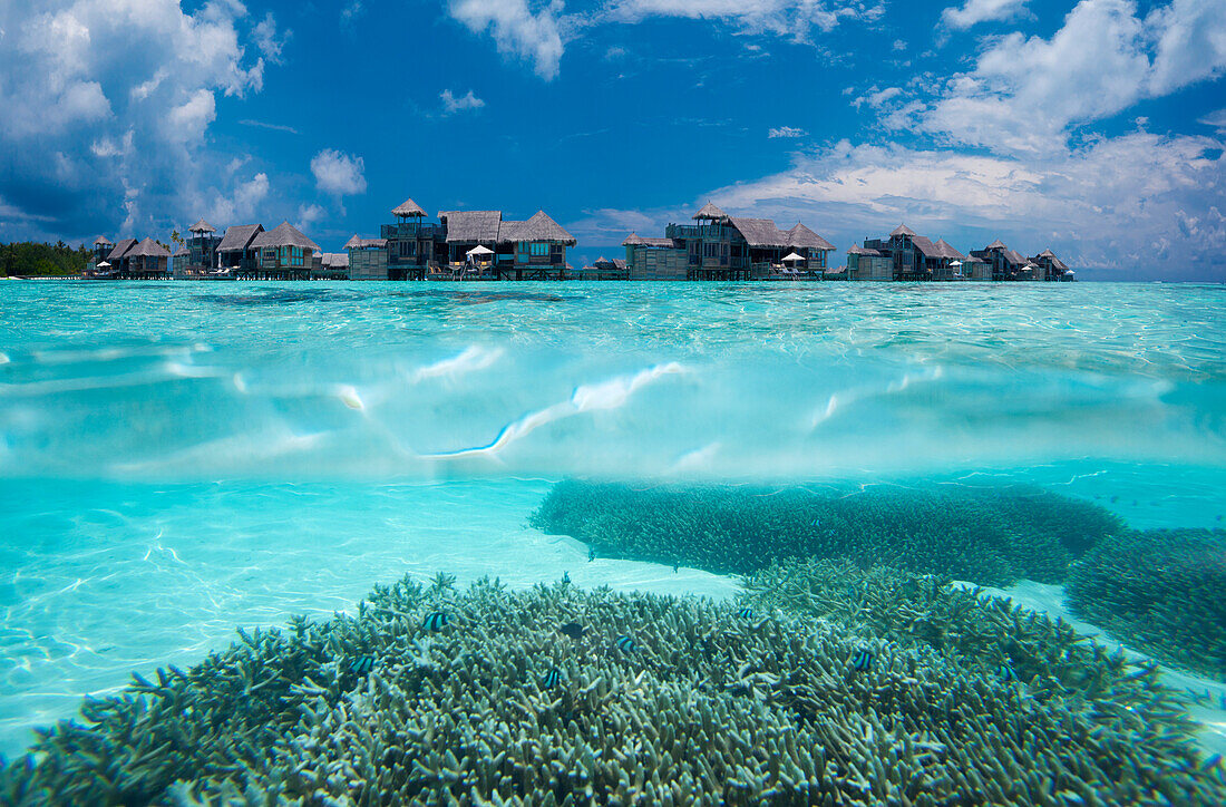 Underwater view of overwater villas at Gili Lankanfushi, in the Maldives.