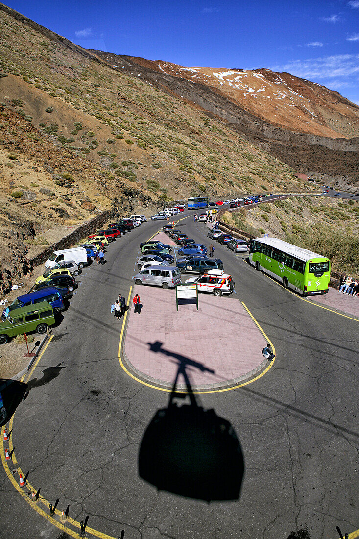 Shadow of the cable car on the road at Teide National Park, Tenerife