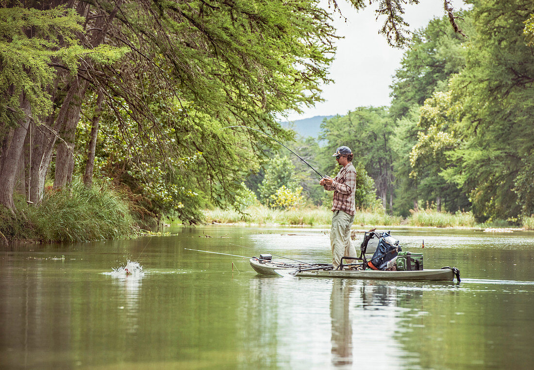 Joseph catches a bass in Texas Hill Country