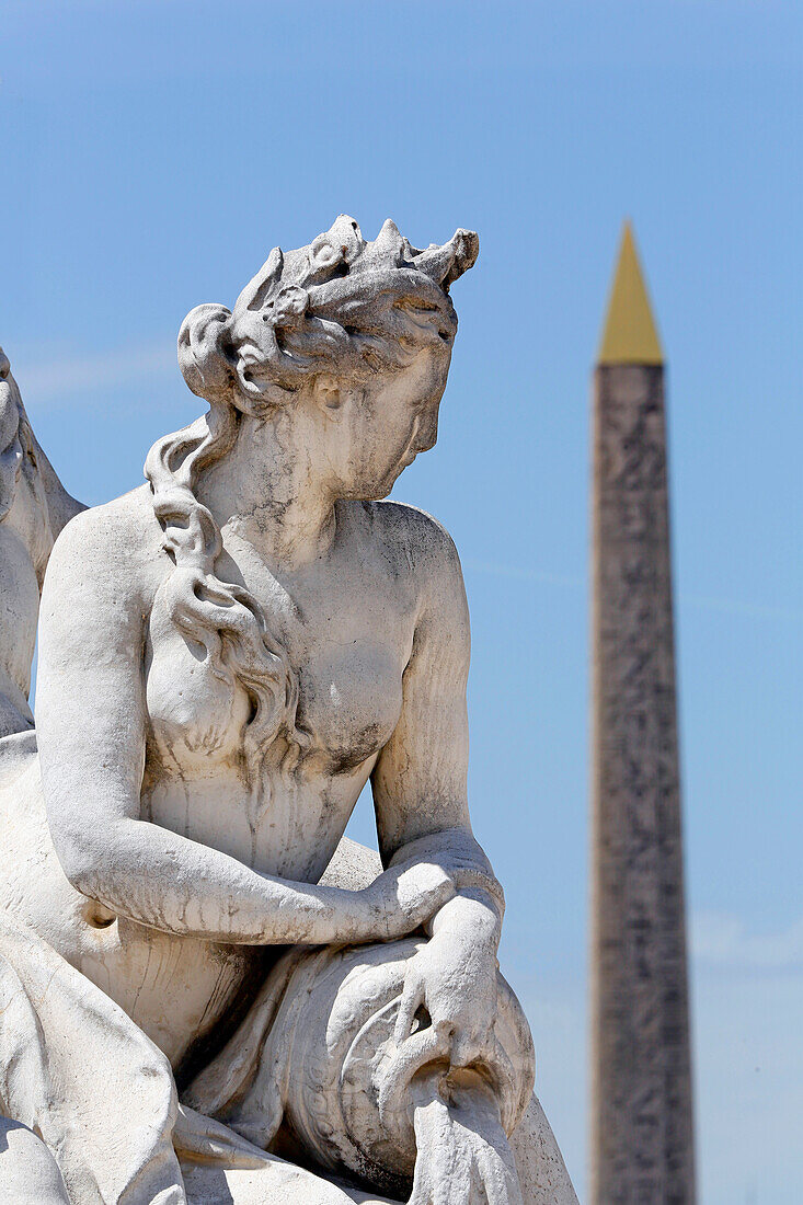 'France, Paris. 1st arrondissement. Jardin des Tuileries. Sculpture ''The Loire and the Loiret'' by Corneille van Cleve. The Luxor Obelisk in the background.'